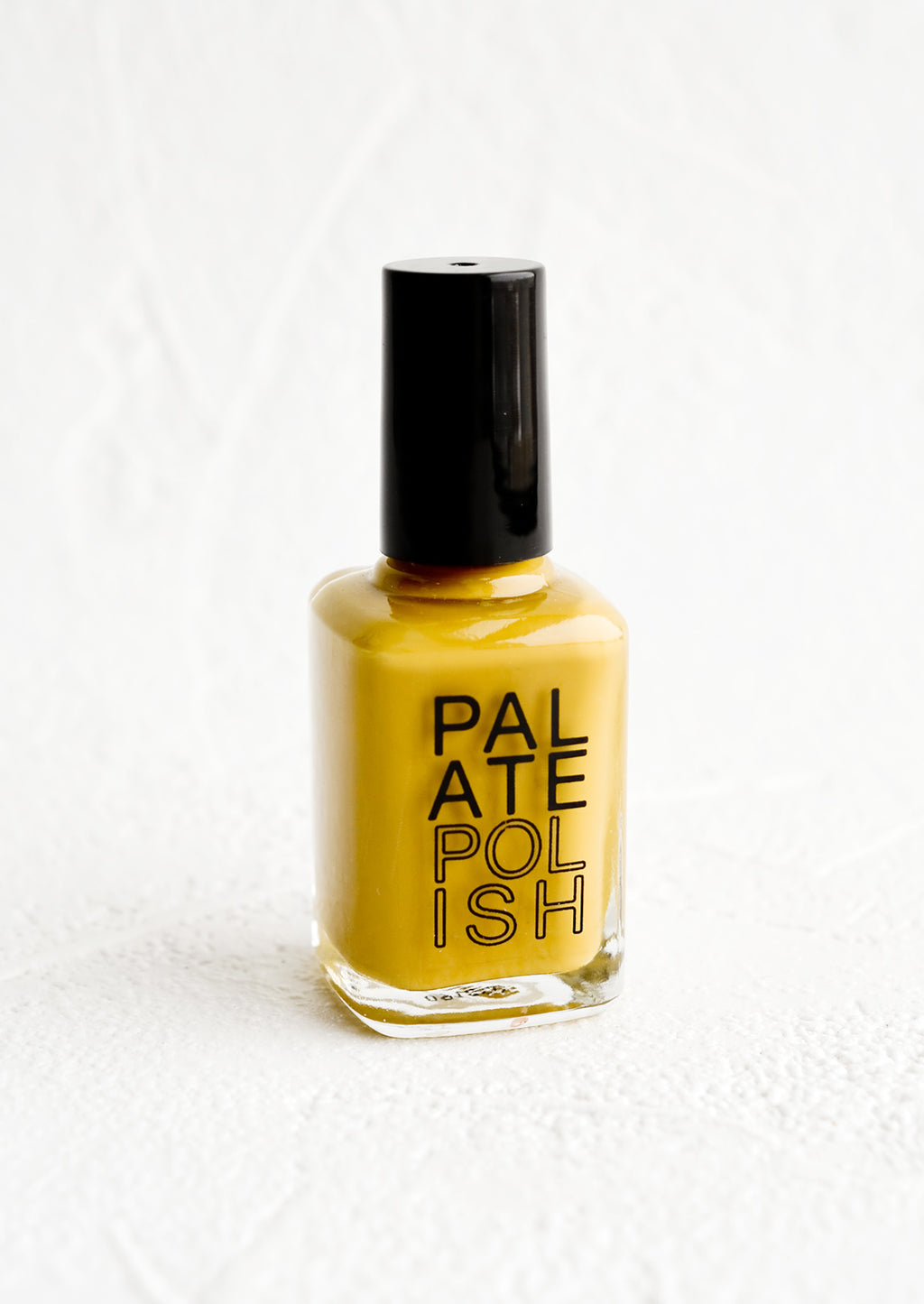 Turmeric: A bottle of nail polish in mustard.