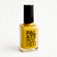 Turmeric: A bottle of nail polish in mustard.