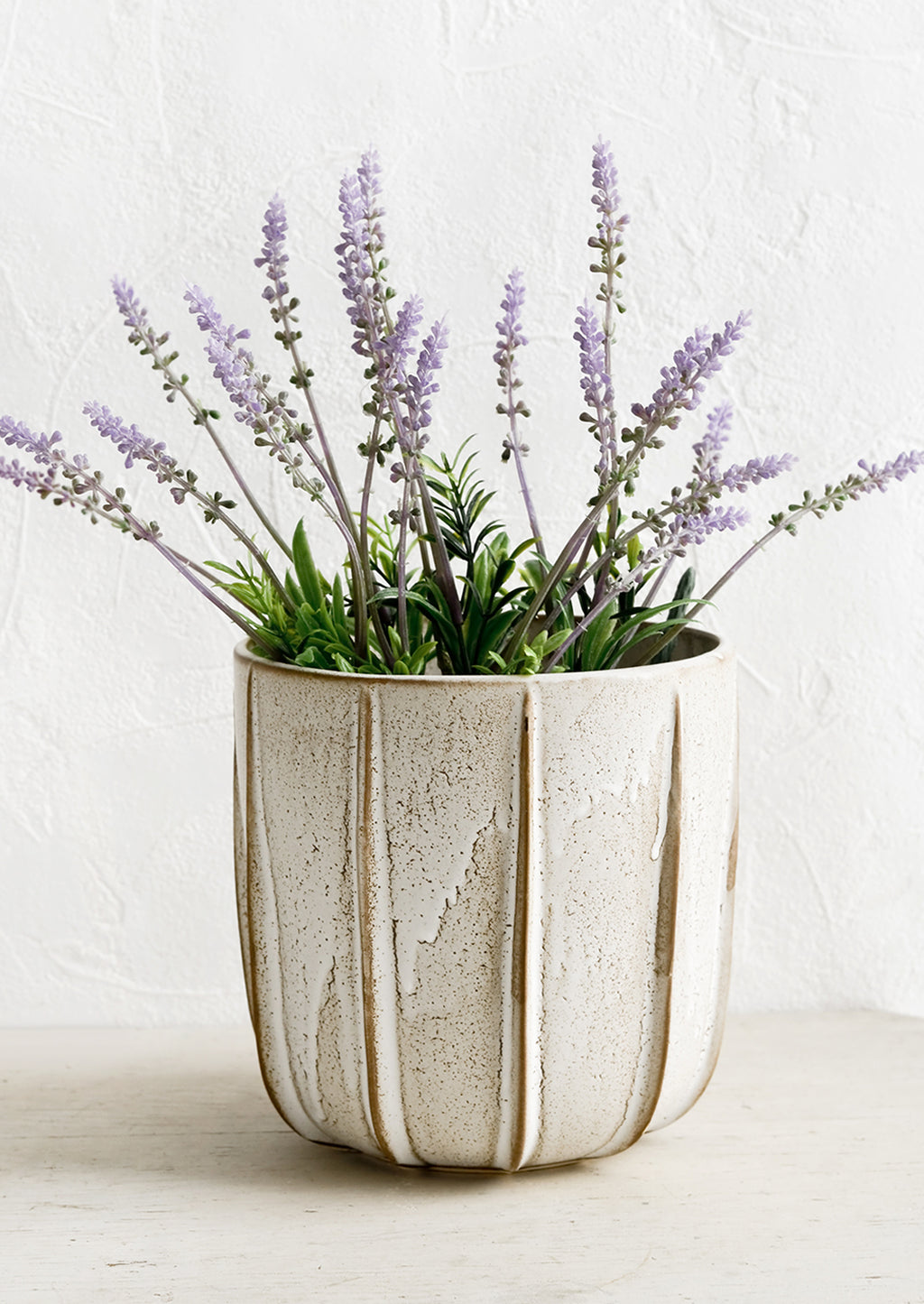 1: A ceramic planter with lavender plant.