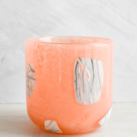 2: Peach glass cup with white and grey inlay pattern.