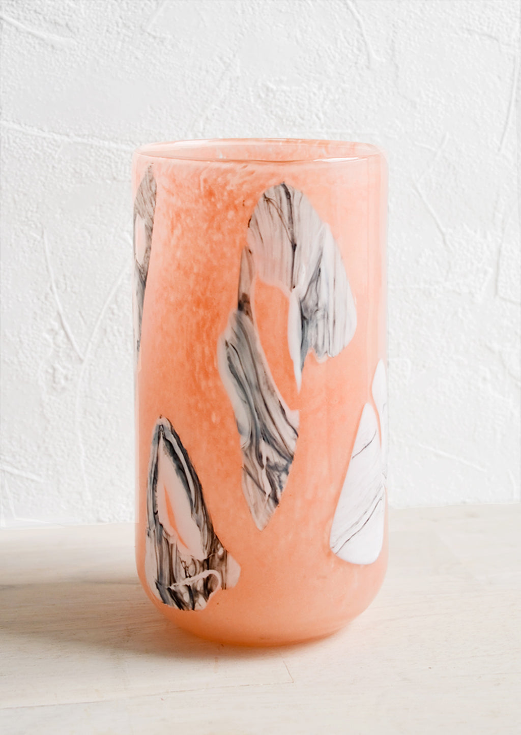 1: Peach glass vase with white and grey inlay pattern.