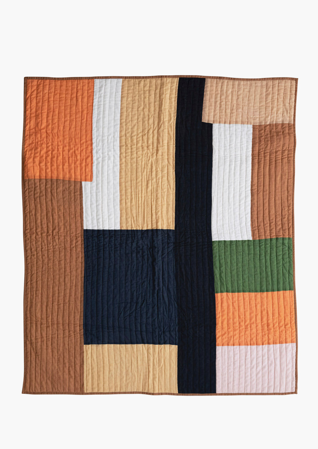 2: A paneled patchwork quilt in orange and brown tones.