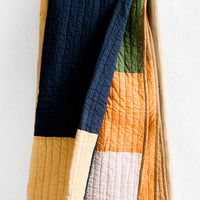 1: A colorblocked cotton quilt.