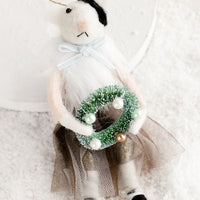 Wreath: A felted holiday ornament of a cat wearing a dress, holding a wreath.