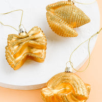 1: Glass ornaments in the shape of pasta.