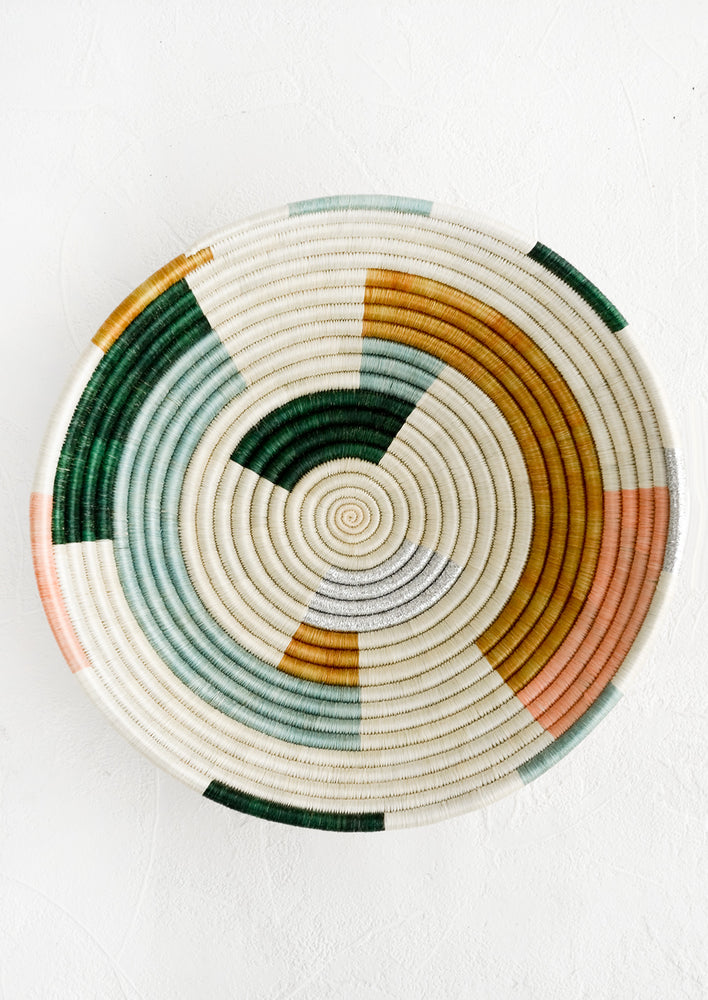 A round woven sweetgrass bowl viewed from above.