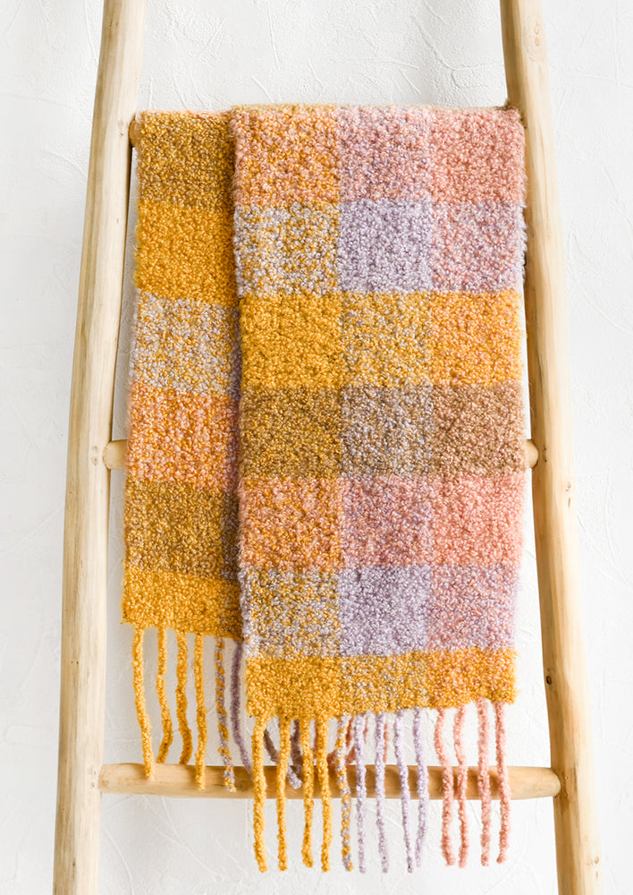 A teddy textured scarf in pastel check print.