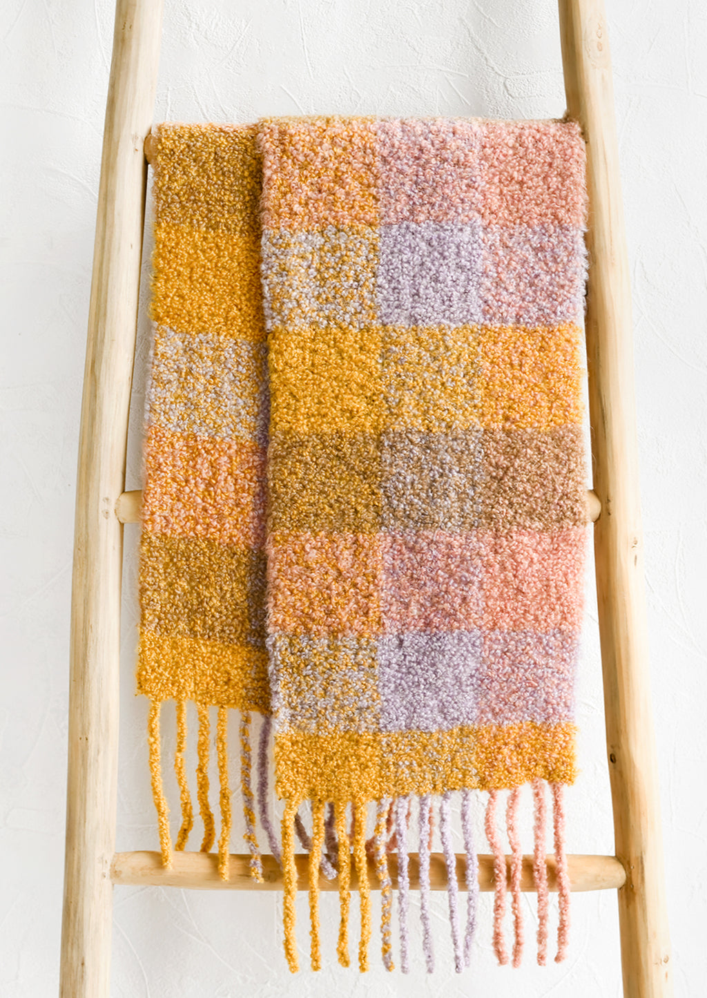 1: A teddy textured scarf in pastel check print.