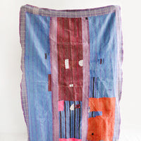 1: Vintage patchwork quilt in a mix of colors and fabrics. Predominantly blue, red and pink.
