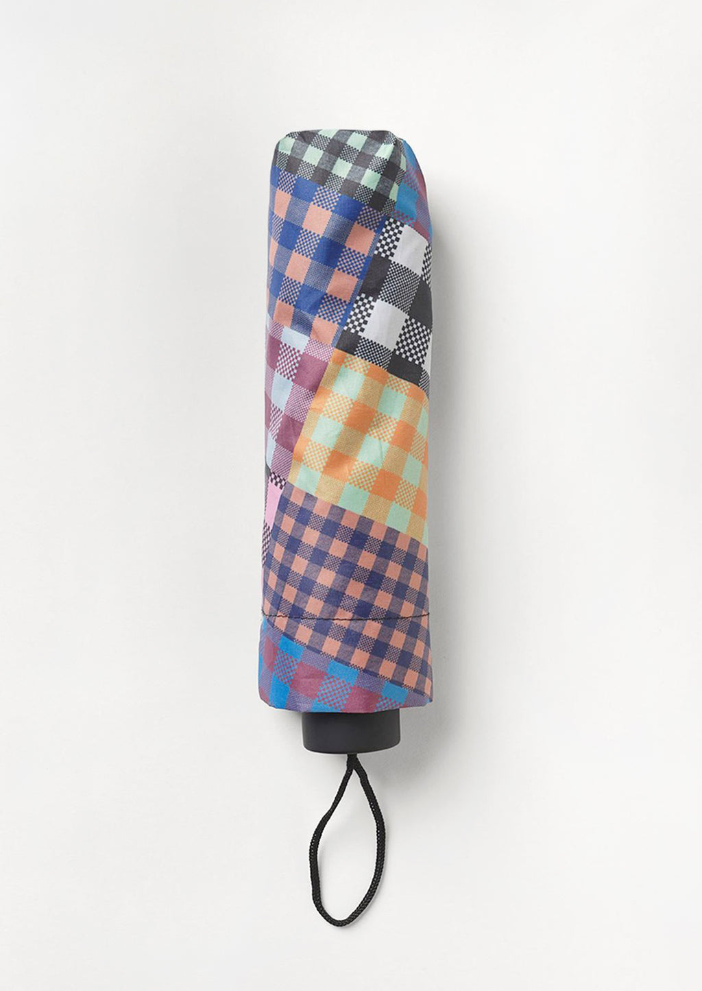 1: A nylon umbrella in checkered patchwork print.