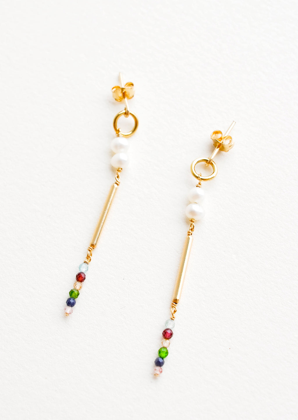 1: Dangling earrings featuring a small circle, two pearl beads, a gold post and six small multicolor gemstones on a yellow gold post back.