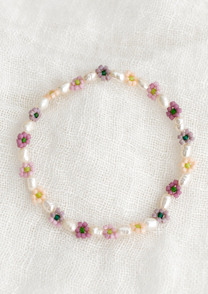 White Multi: A beaded bracelet with white pearls and multicolor flowers.