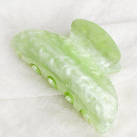 Lime Sherbet: A plastic hair claw in pearlized lime.