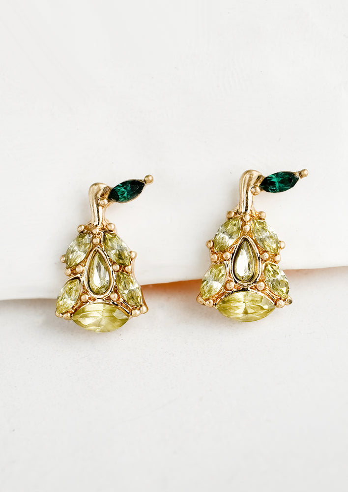 A pair of pear shaped stud earrings.