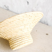 2: Woven raffia bowl with tapered top and round, footed base