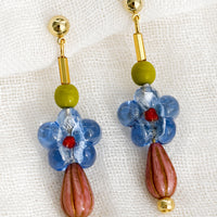 Blue Multi: A pair of multi beaded drop earrings with blue glass flower bead at center.