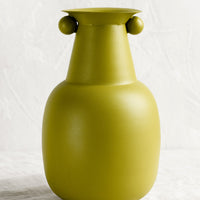 1: A lime green vase with round ball detailing at top.