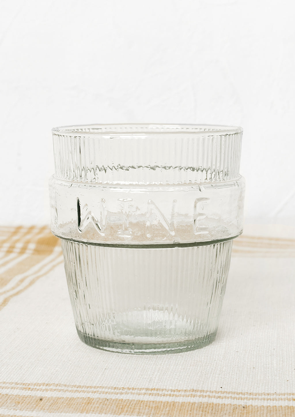 1: A short ribbed clear glass cup labeled "wine".