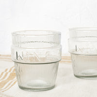 3: Two short ribbed clear glasses labeled "wine".