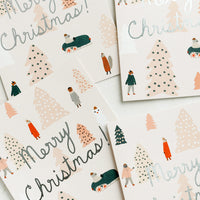 Boxed Set Of 8: A greeting card set with animals surrounded by pink Christmas trees and silver text reads "Merry Christmas!".