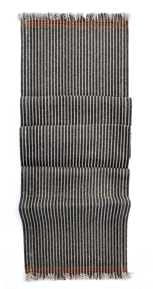 Charcoal: Jute table runner in charcoal with white pinstripes. Frayed ends with orange stitching.