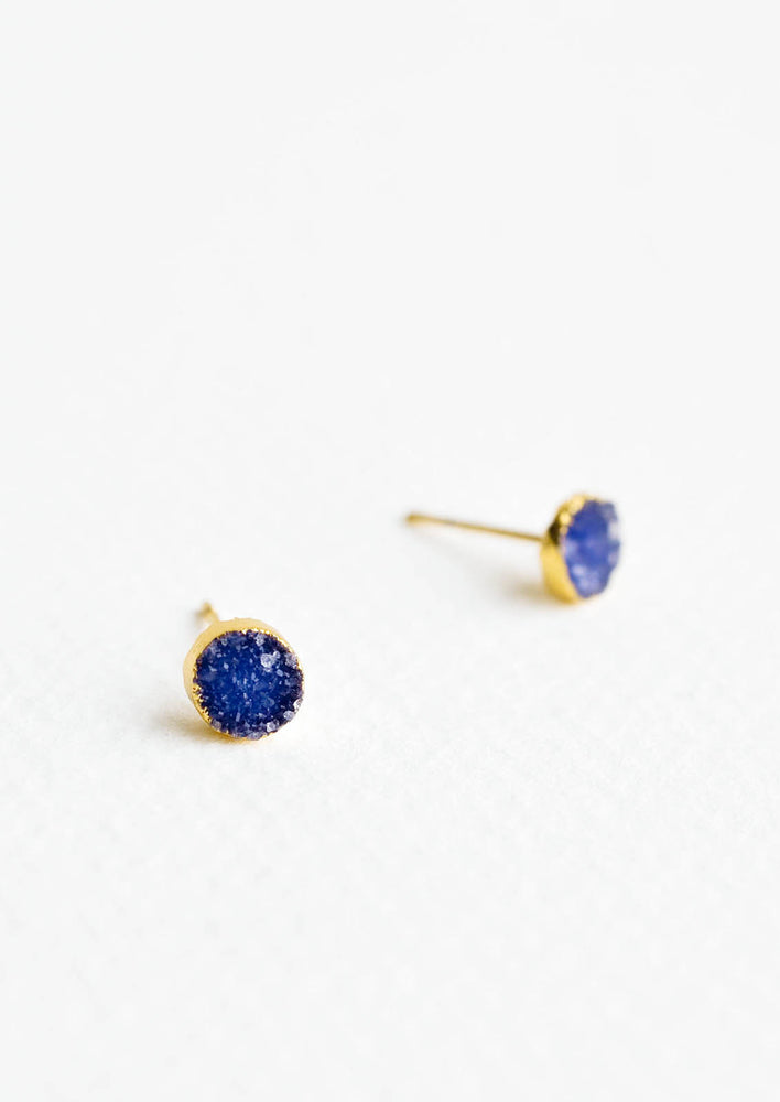 Textured blue gemstone studs with gold surround.
