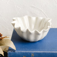 Small: A white bowl with wavy shell-like shape.