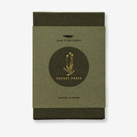 2: A green linen covered pocket-sized flower press booklet.