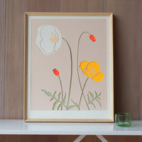 2: A lasercut art print depicting poppy flowers on blush background.