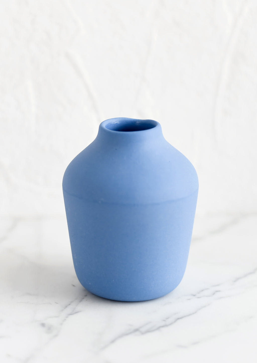 Cornflower: A cornflower colored porcelain bud vase.