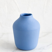 Cornflower: A cornflower colored porcelain bud vase.