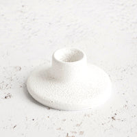 Short: Short white ceramic taper holder in bubble-textured rough white glaze