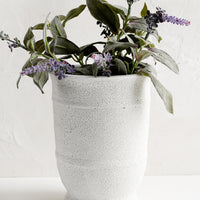Small: A tall planter in textured white glaze with lavender plant.