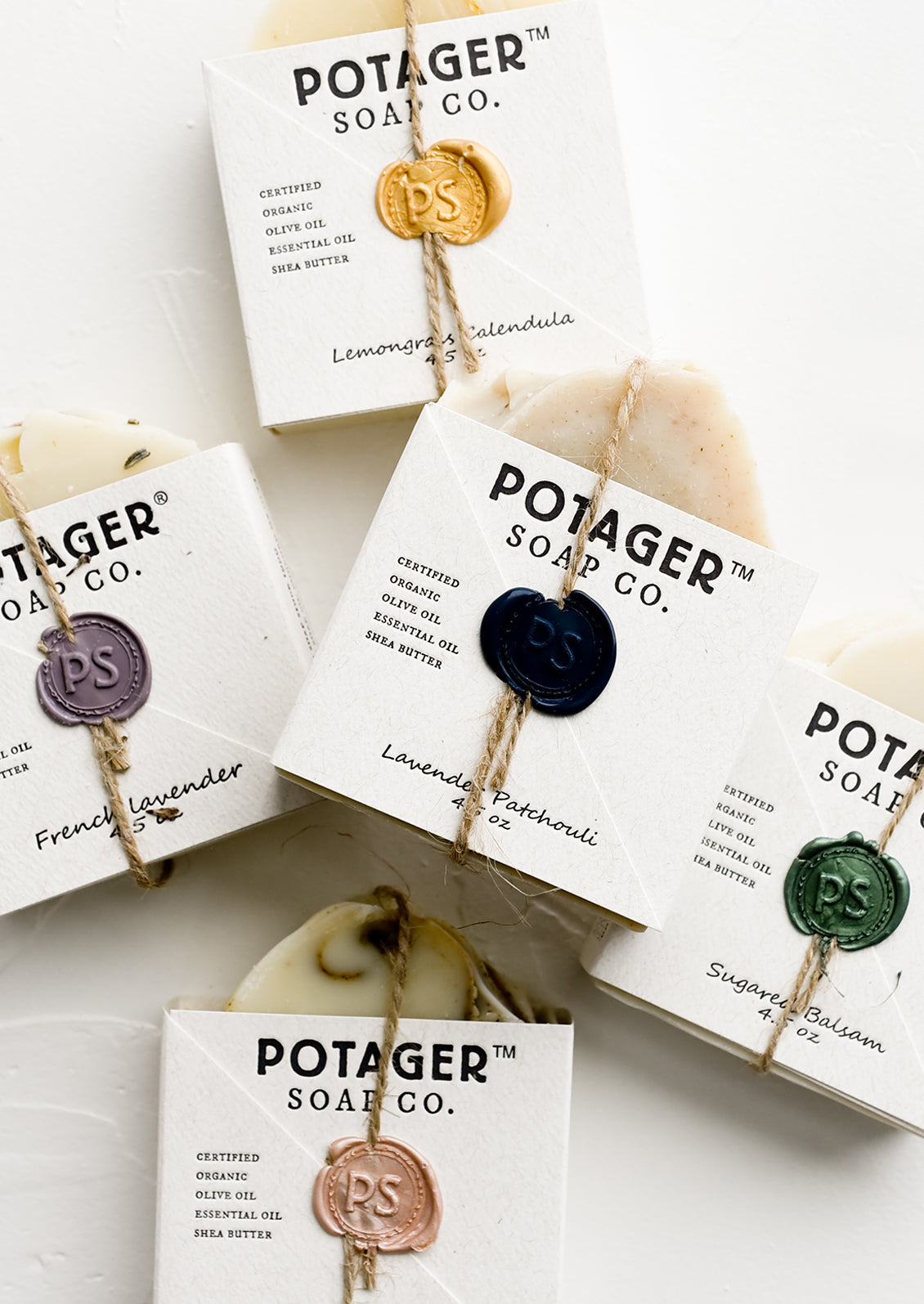 Assorted bar soaps with wax seal packaging.