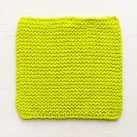 Lime: A square, chunky knit cotton potholder in lime green.