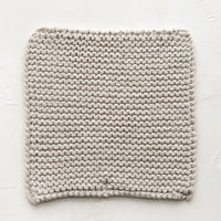 Oyster: A square, chunky knit cotton potholder in oyster grey.