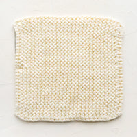 Vanilla: A square, chunky knit cotton potholder in off white.