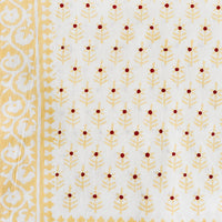 2: A cotton tablecloth in yellow and red floral block print motif.
