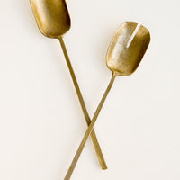 Brass: Two piece salad serving set in a primitive silhouette, made in natural unpolished brass