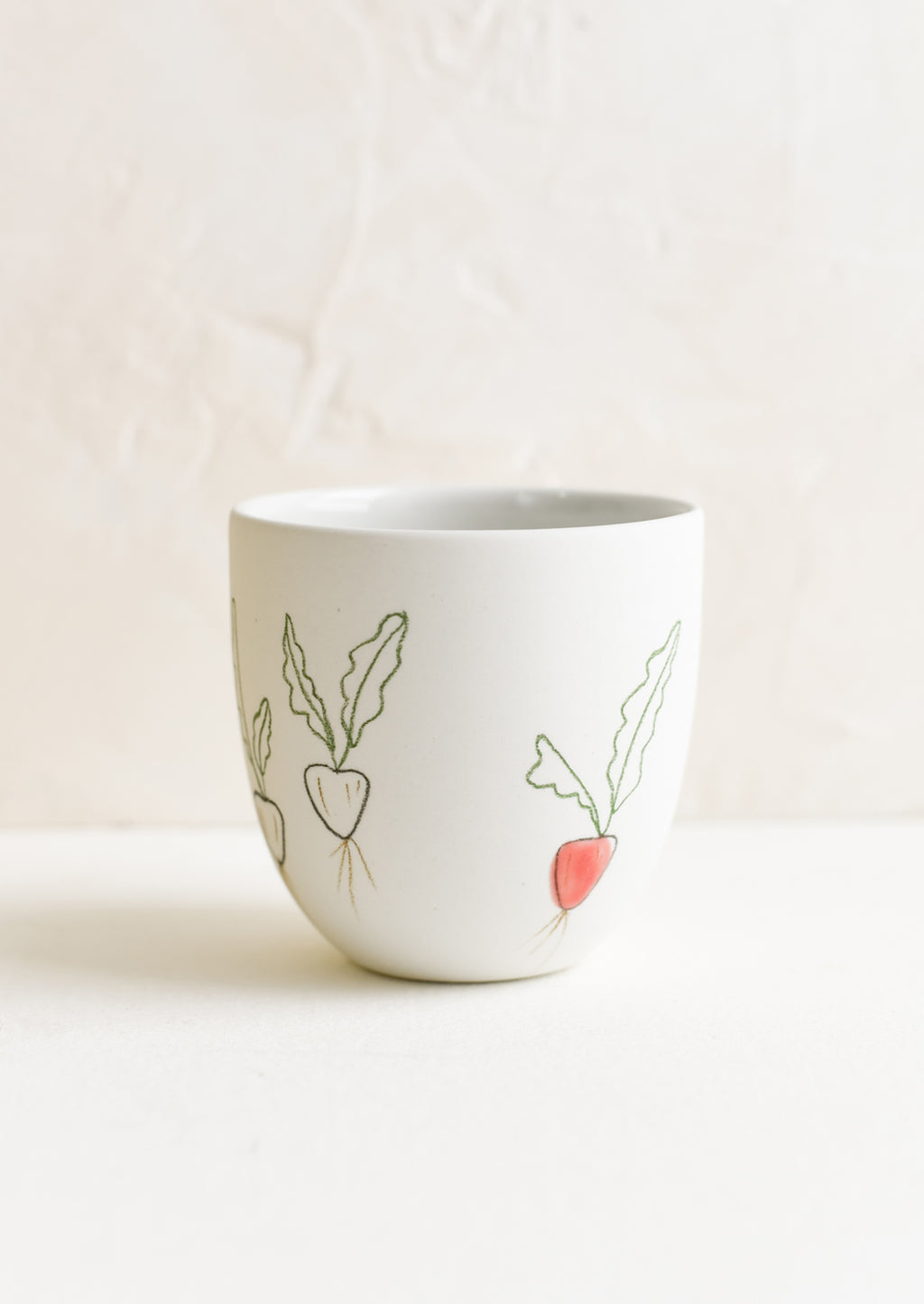 Small / Radish: A small porcelain cup with hand drawn radishes.