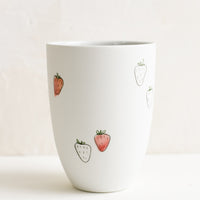 Large / Strawberry: A tall porcelain cup with hand drawn strawberries.