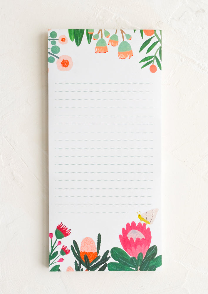 A list notepad with colorful botanical print.