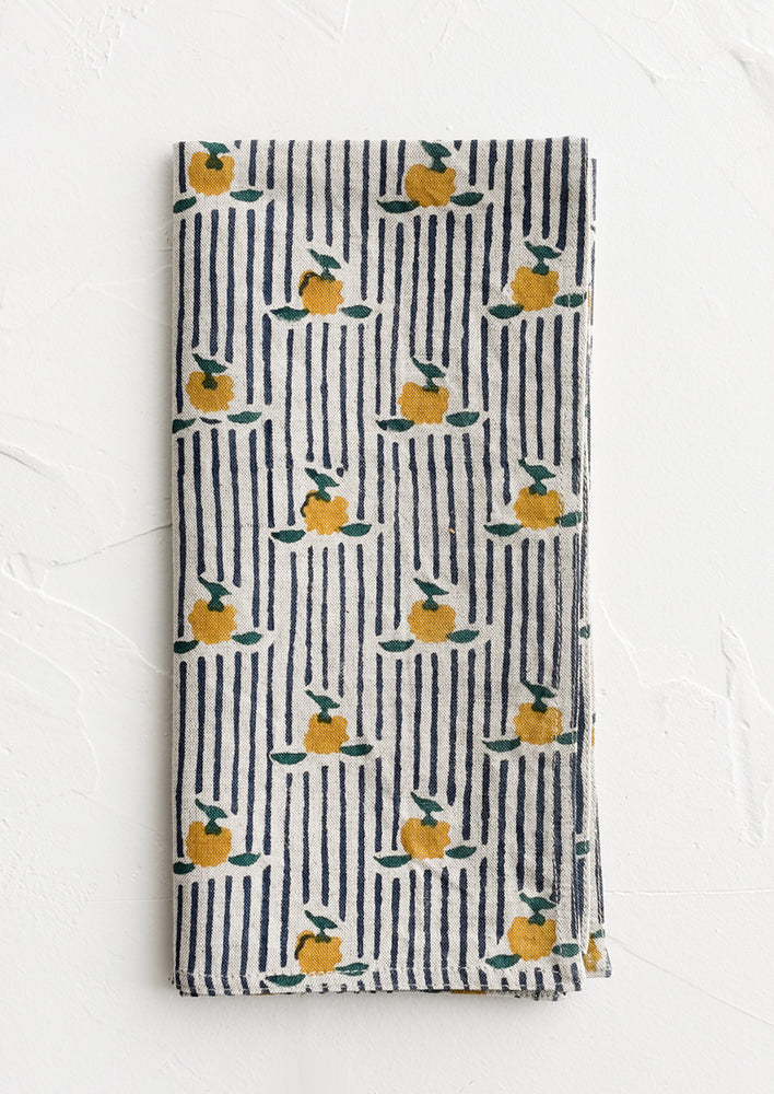 1: A block printed cotton napkin in stripe and floral pattern.