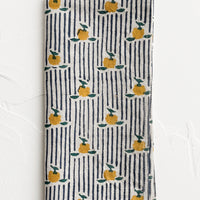 1: A block printed cotton napkin in stripe and floral pattern.