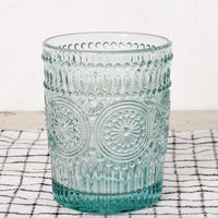 Aqua: An aqua glass cup in embossed design.