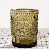 Olive: An olive green glass cup in embossed design.