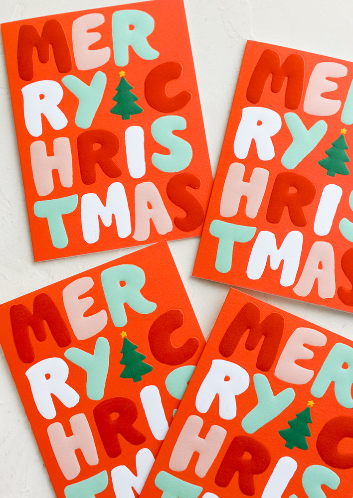 Boxed Set of 8: A red card set with red, white and green raised lettering reading "Merry Christmas".