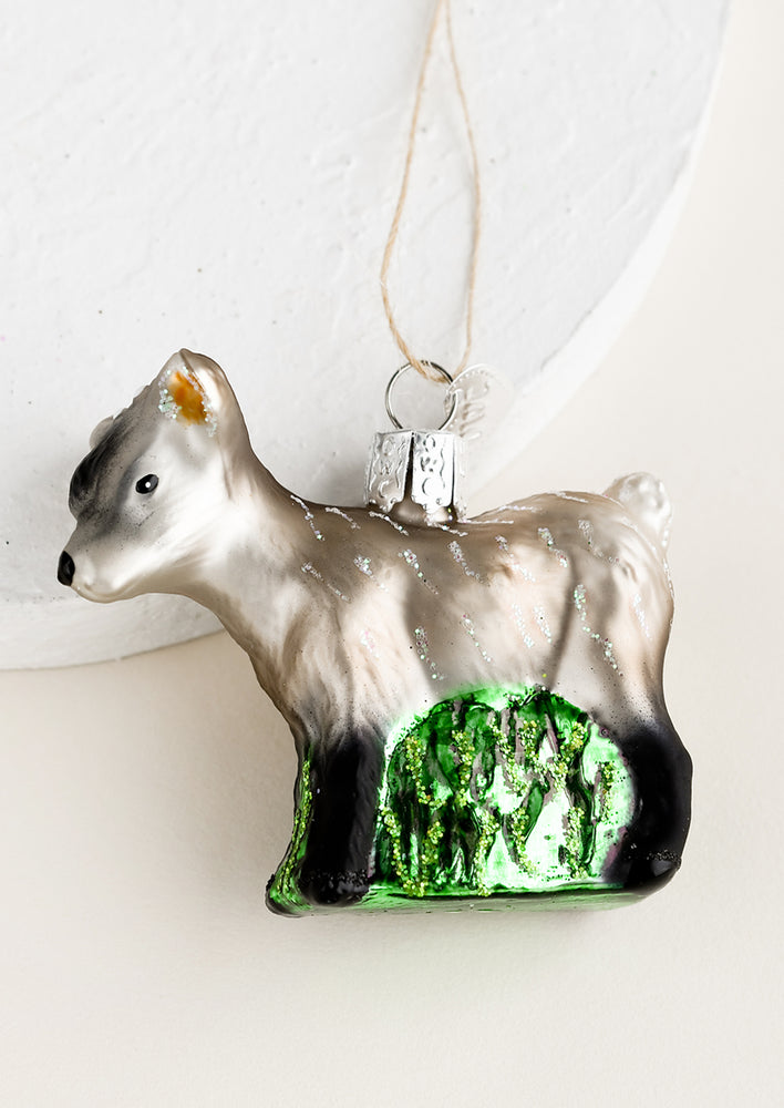 A glass ornament of a pygmy goat.
