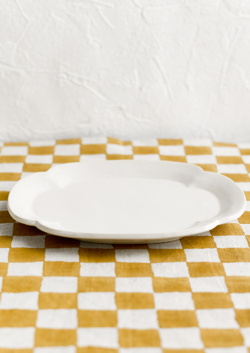 2: A quatrefoil shaped white ceramic platter/plate.