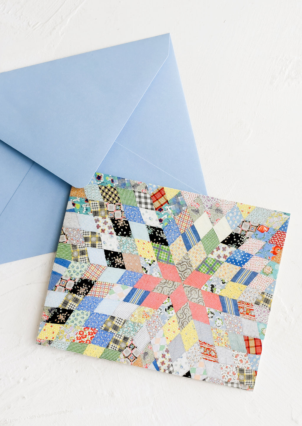 3: A card and envelope with quilt pattern.
